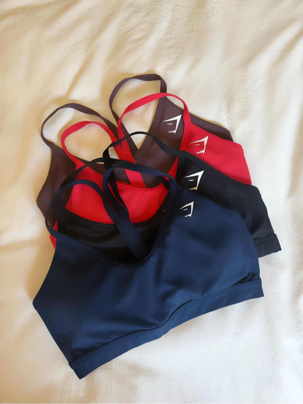 Gymshark Women's Seamless Sports Bras in Navy, Black, Vibrant Orange, Coffee